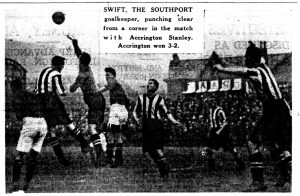 Swift, the southport goalkeeper, punching clear from a corner in the match with Accrington Stanley.